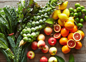 a group of fruits and vegetables on a wood surface Healthy Weight Loss Diets Weston Super Mare
